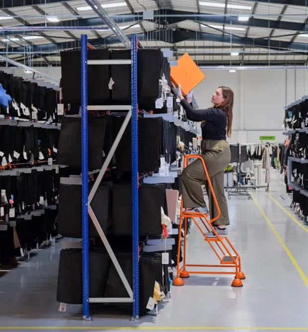 ChicHub team member picking a boxed order from the storage racks