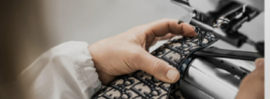 Sewing machine stitching an oblique-pattern bag panel